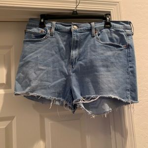 LEVI’S Women’s high rise shorts size 33 with 34” waist.